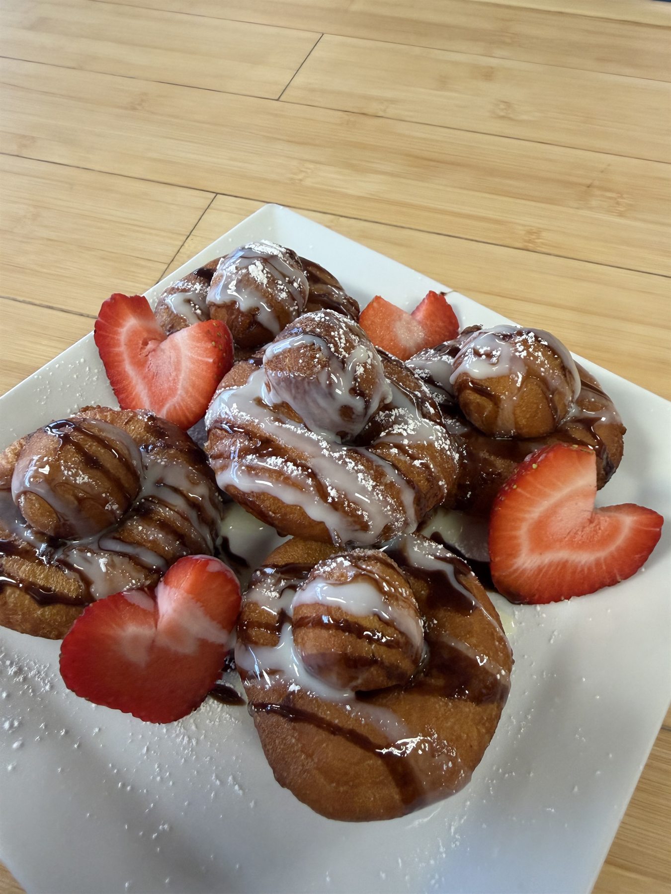 Thai donuts drizzled with condensed milk and chocolate at Ocha Thai